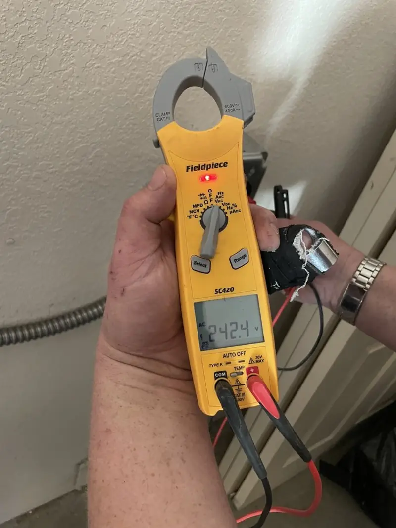Voltage testing with clamp meter during Outlet Installation in White Lake